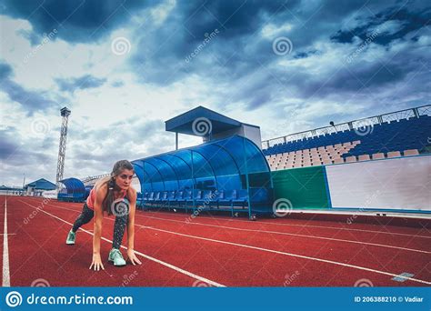 Track Runner Athlete Woman Warming Up Before Running At A Stadium Stock