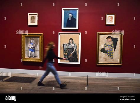 Employees pose during a press preview of ‘The EY Exhibition: Picasso