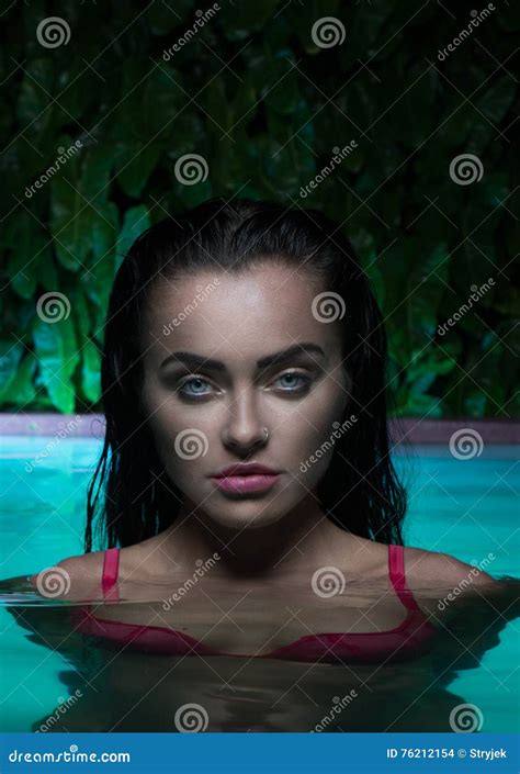 Closeup Portrait Of Brunette Woman Wearing Pink Bikini Standing In