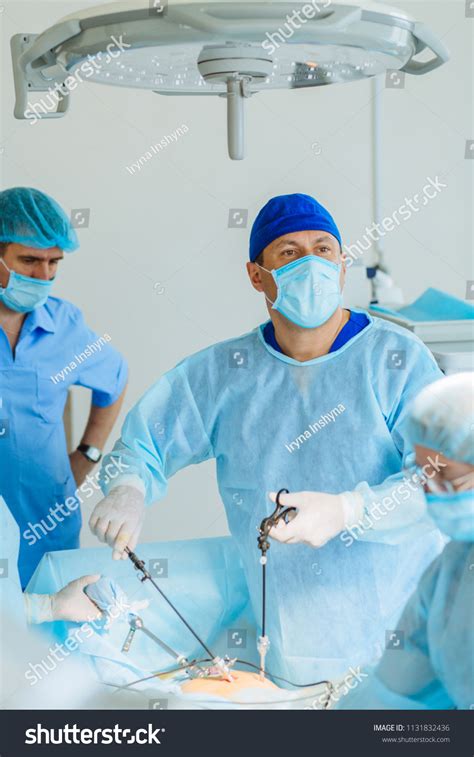 Surgeons Team Preforming Operation Uterus Removal Stock Photo
