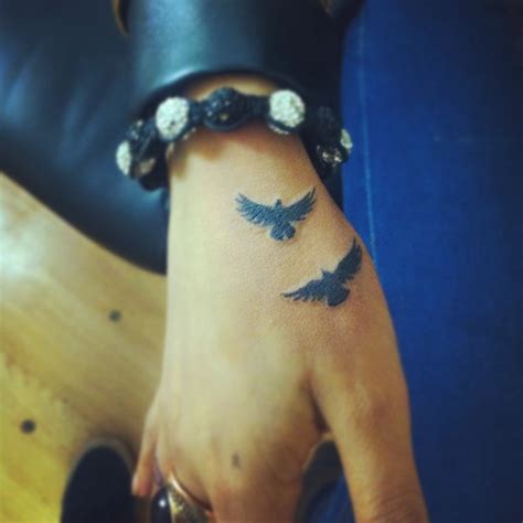 Two Birds Tattoo On Hand