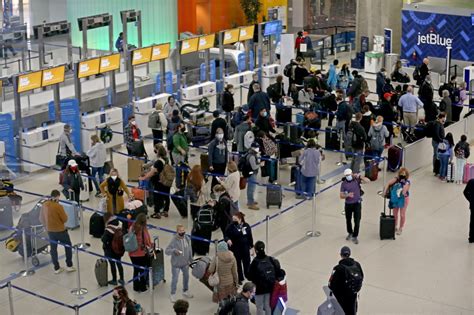 boston s logan airport flight cancellations top 100 on busy holiday weekend travel day amid