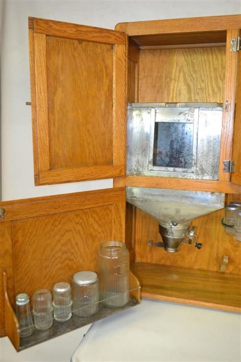 See the skirt at the top of the picture below and how it's separating? Oak Hoosier Cabinet w/ White Enamel Top