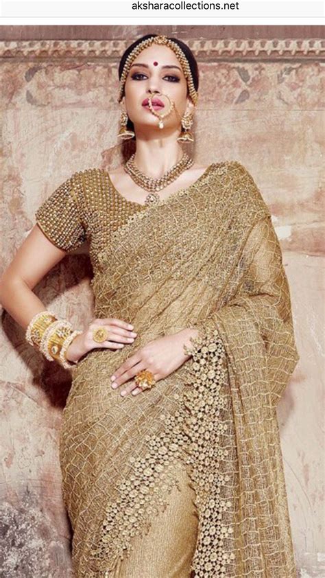 golden net saree indian wedding reception outfits golden saree saree designs