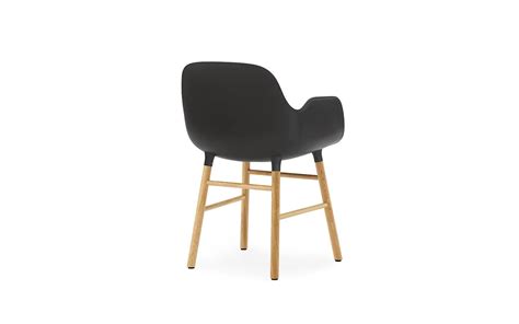 Bright fuchsia armchair, baby seat. Form Armchair | Molded plastic armchair with oak legs