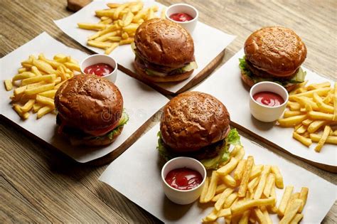 Set Of Burgers With French Fries And Ketchup Sauce Stock Photo Image
