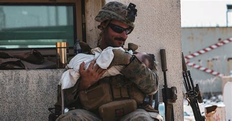 Photo Of Marine Holding Infant In Afghanistan Goes Viral