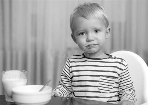 Toddler Having Snack At Home Boy Cute Baby Eating Breakfast Child Eat