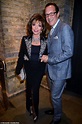 Joan Collins, 86, steps out with husband Percy Gibson, 54, at the ...