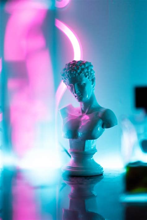 Statue Lit By Neon Lights · Free Stock Photo