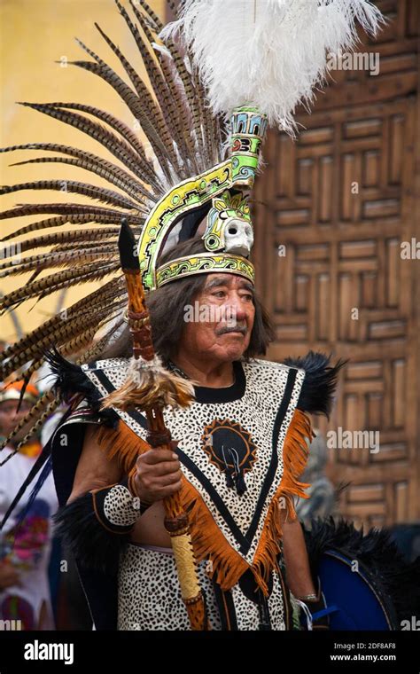 A Mexican Man In Aztec Indian Costume And Feathered Headdress