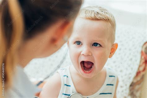 Little Boy Opening Mouth During Examination Stock Photo Adobe Stock