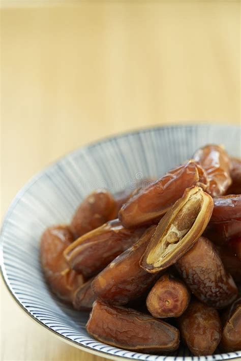 Sweet Dried Dates Fruit In A Bowl And On The Table Stock Image Image