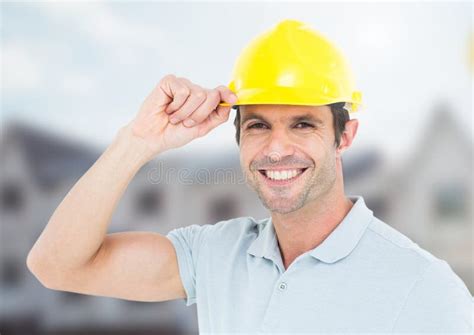 Construction Worker With Safety Helmet In Front Of Construction Site