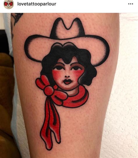 A Woman Wearing A Cowboy Hat And Scarf On Her Leg With The Words Love