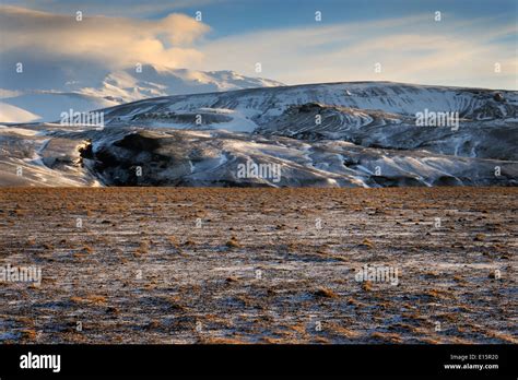 Icelandic Landscape With View On The Hekla Volcano And Frozen Lava