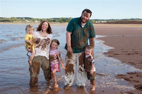 Mother And Kids Playing In Mud Stock Image Image Of