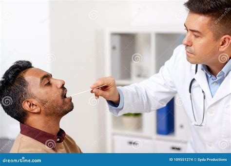 Doctor Examining Patient Throat At Clinic Stock Photo Image Of