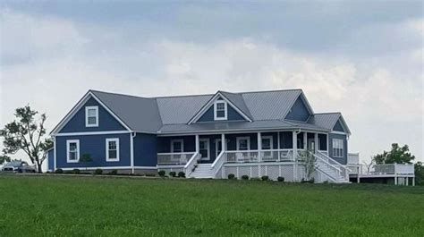 Dark blue plus lots of white trim is a great look! dark blue siding house metal roofing home interior ...