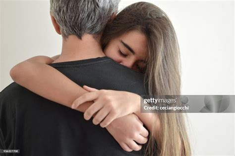 Teenage Girl Hugging Her Father High Res Stock Photo Getty Images