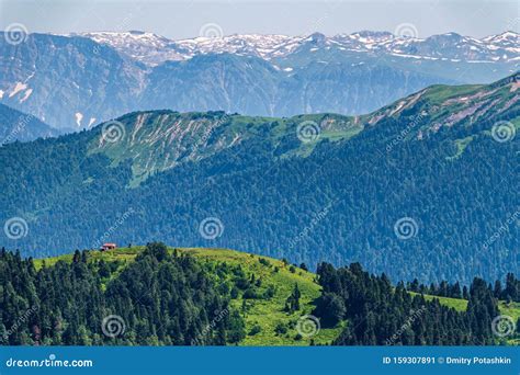 Green Mountain Ridges Surrounded By High Mountains Snow Capped