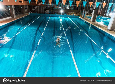 Swimmer In Competition Swimming Pool Stock Photo By ©arturverkhovetskiy
