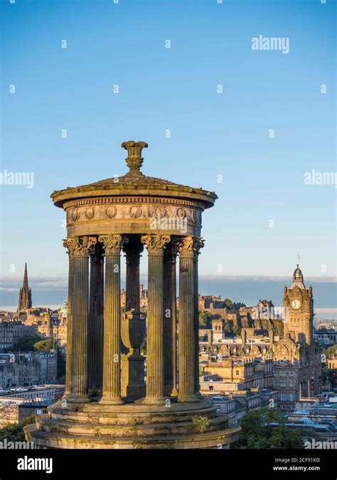 Sunrise View Of Dugald Stewart Monument Edinburgh Castle And The