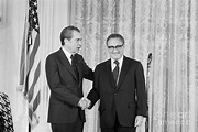 Nixon Shakes Hands With Kissinger by Bettmann