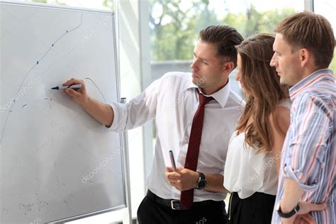 Leader Explaining Something On Whiteboard — Stock Photo © Opolja 12858896