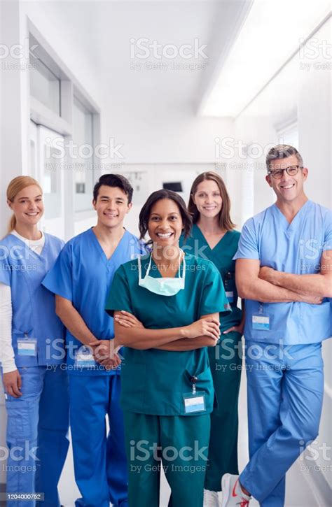 Portrait Of Smiling Multicultural Medical Team Standing In Hospital