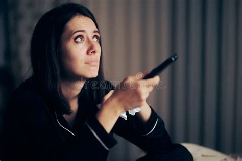 Sad Woman Crying Watching Tv Holding A Remote Control Stock Photo
