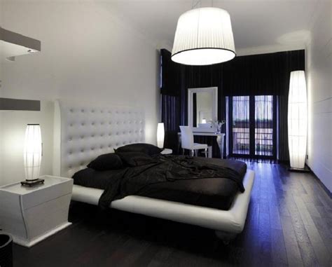 Add a black and white striped bed skirt, pillows, and a comfortable black chair. Contemporary Black and White Bedroom Designs and Ideas ...