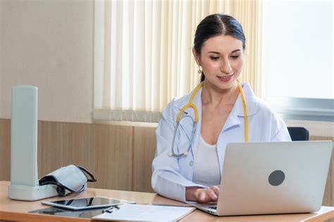 Free Stock Photo Of Female Doctor Using Laptop To Work Or Read Medical