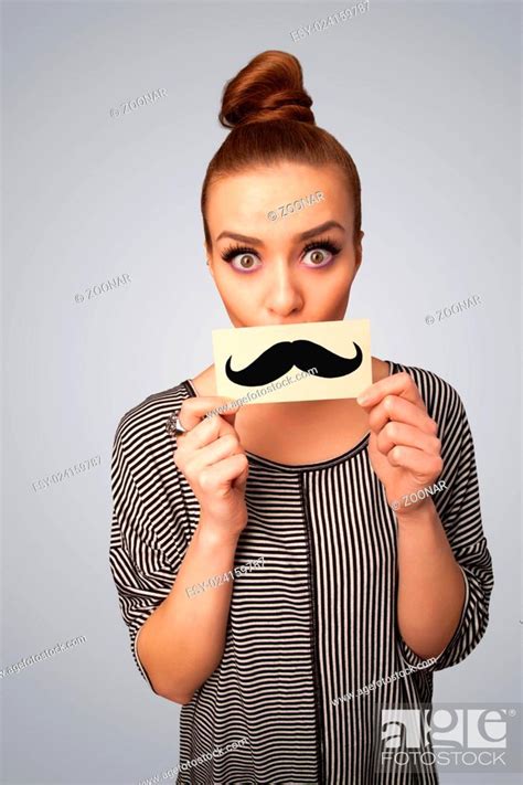 Happy Cute Girl Holding Paper With Mustache Drawing Stock Photo