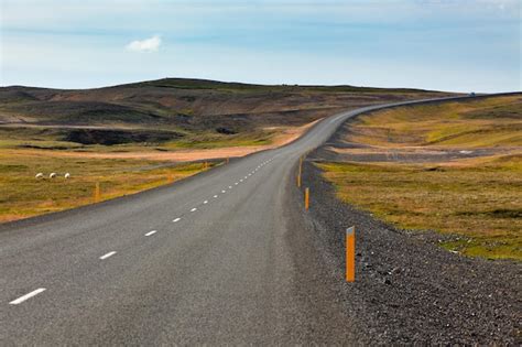 Premium Photo Highway Through Icelandic Landscape Under A Blue Summer Sky