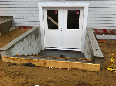 Second story deck designs simple plans know the rules for finished basements basement during after basement entry door 10 front entrance ideas concrete. Pin on Walkouts