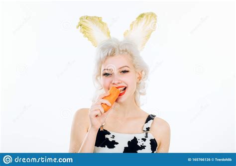 Beautiful Young Blond Woman As Easter Bunny With Rabbit Ears On White