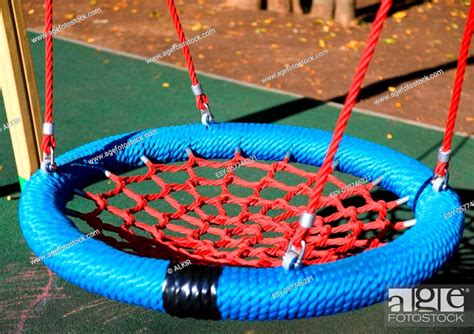 Empty Swings In Children Playground Closeup Stock Photo Picture And