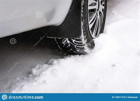 Close Up Of A Cars Tires On A Snowy Road Stock Photo Image Of