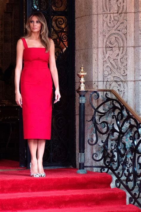 gq magazine melanija trump wears red a dress to meet the president of china and the first lady