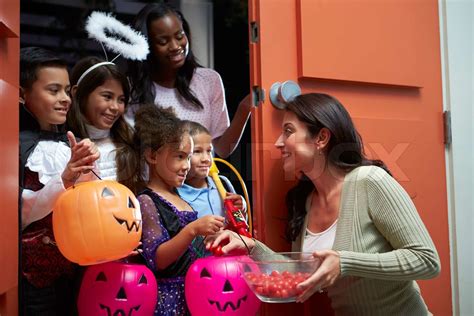 Children Going Trick Or Treating With Mother Stock Image Colourbox