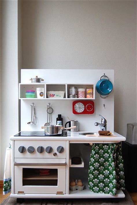 In case you have a divider that's still bare, you can set up cabinets on it or a ledge to be used as storage. 10 DIY Play Kitchen Sets | Home with Design