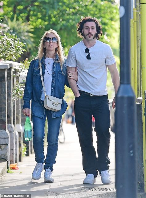 aaron taylor johnson 32 enjoys stroll with wife sam 56 after entering race to be next james