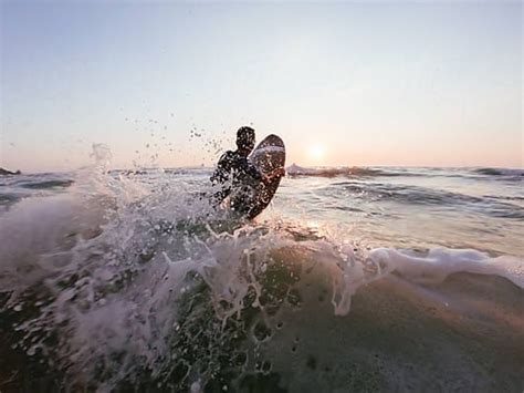 Boy Surfing On The Ocean By Stocksy Contributor Dejan Ristovski