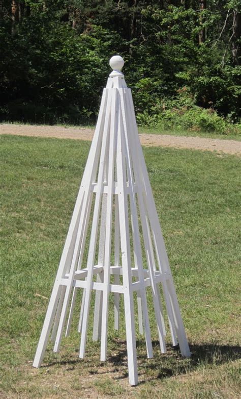 The freestanding classic home and garden wood obelisk (appx. 20 Easy DIY Trellis Projects to Really Prop Up Your Garden