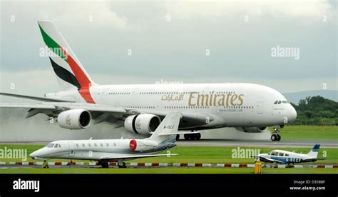 Emirates Airlines Airbus A380 861 E6 Edk Lands On A Wet Runway At Stock