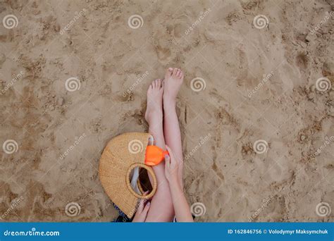 Girl Oil Spray Tanning Her Legs Protection From The Sun`s Uv Rays Putting Sunscreen Lotion