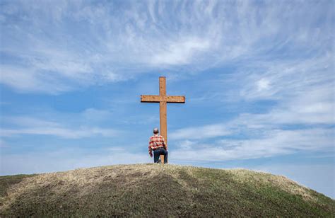 Man Kneeling At Cross Stock Photos Pictures And Royalty Free Images Istock