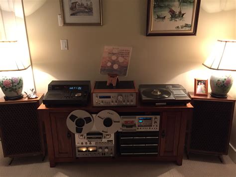 An Entertainment Center With Two Turntables And Stereo Equipment