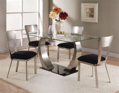 It also features a round top made of solid and stylish glass. Glass Top Dining Tables - HomesFeed